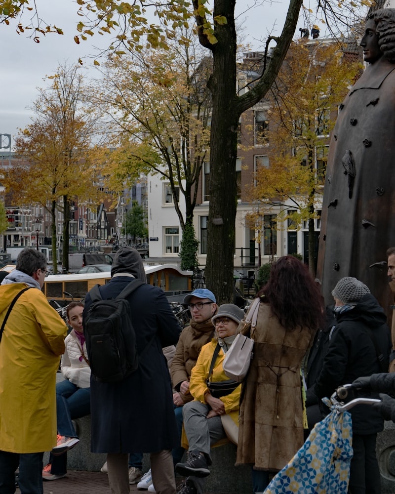 A guide talking to a small group on an Amsterdam street